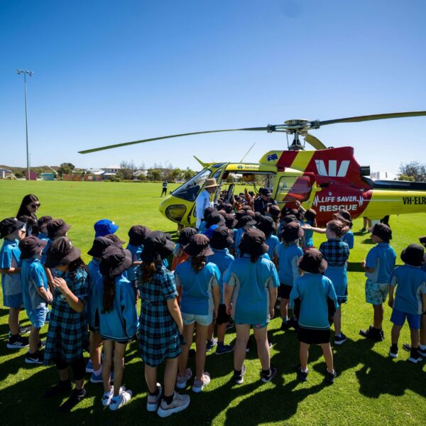 Students at Alkimos Beach Primary School held onto their hats last week as they prepared for a beach safety lesson with a difference, welcoming Surf Life Saving WA’s (SLSWA) Westpac Lifesaver Rescue Helicopter to the Leatherback Oval at Alkimos Beach.