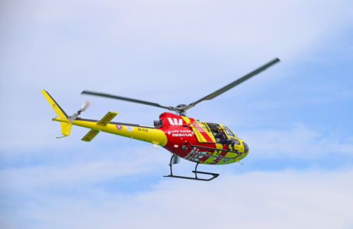 Photo of Westpac Life Saver Rescue Helicopter flying over beaches