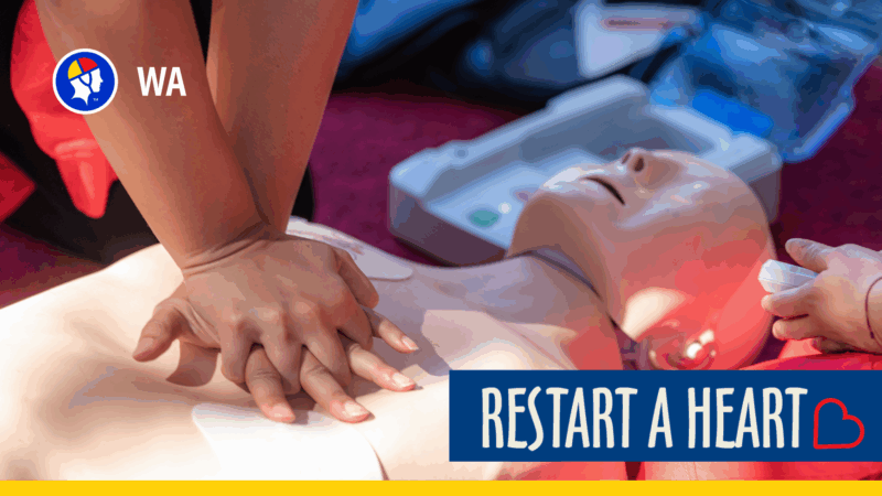 Person performing CPR on a manikin