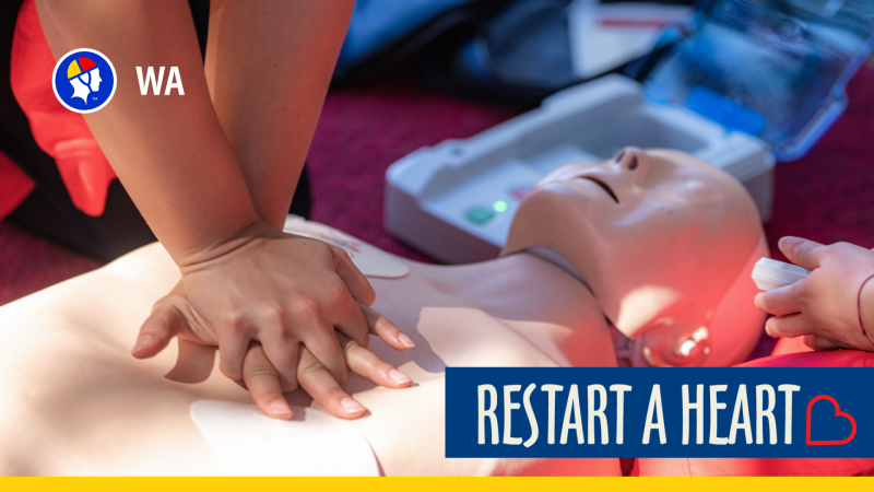 Person performing CPR on a manikin